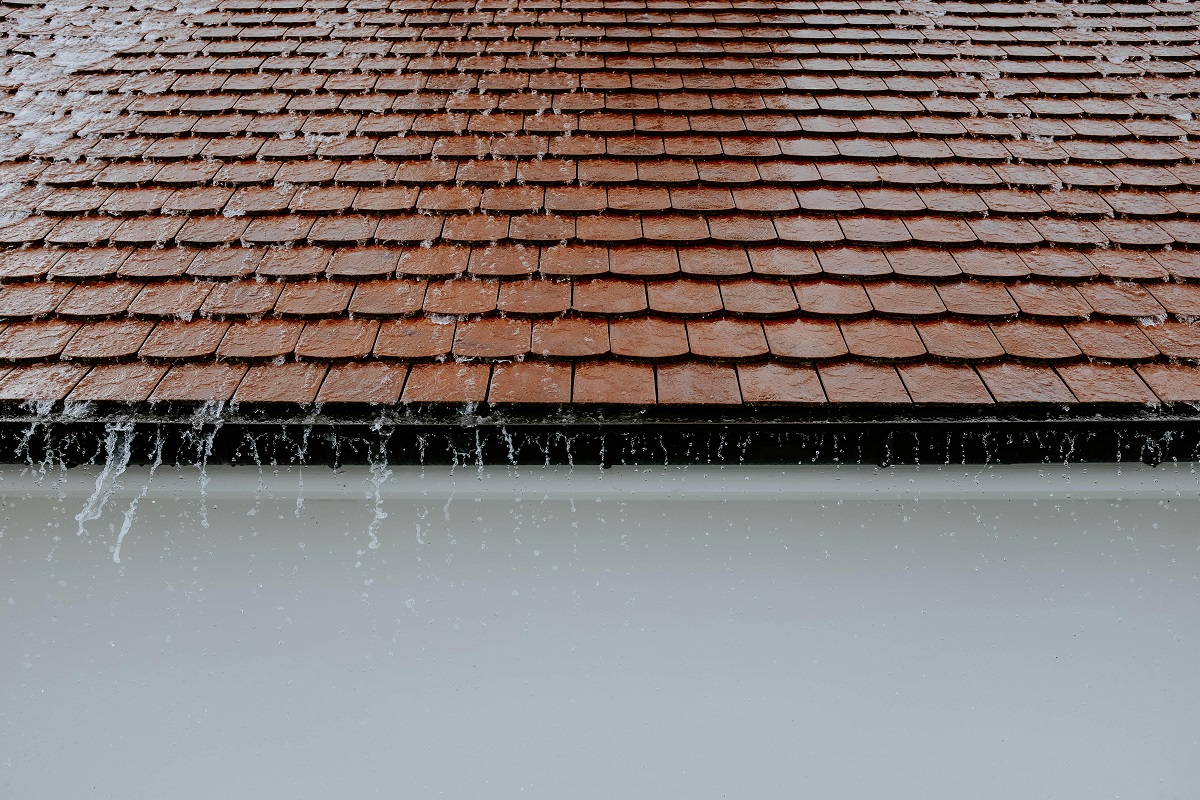 rainwater pouring down a roof